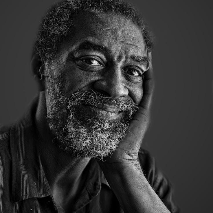 Alex Rivera, Lead Design Curator at QuietFieldWorks, reviewing corporate floral arrangements